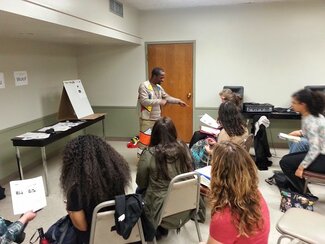 Bheki Madela, Ph.D. student, presents a workshop on Zulu at A Taste of Language, International Week at Illinois